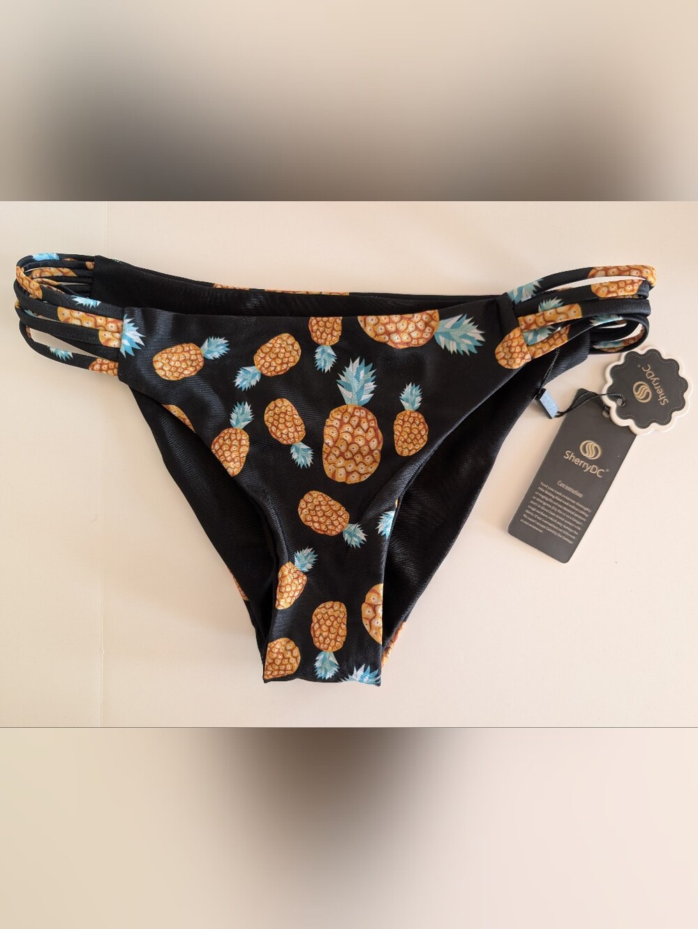 NWT SherryDC Pineapple Print Strappy Bikini Bottoms Black Gold Size S